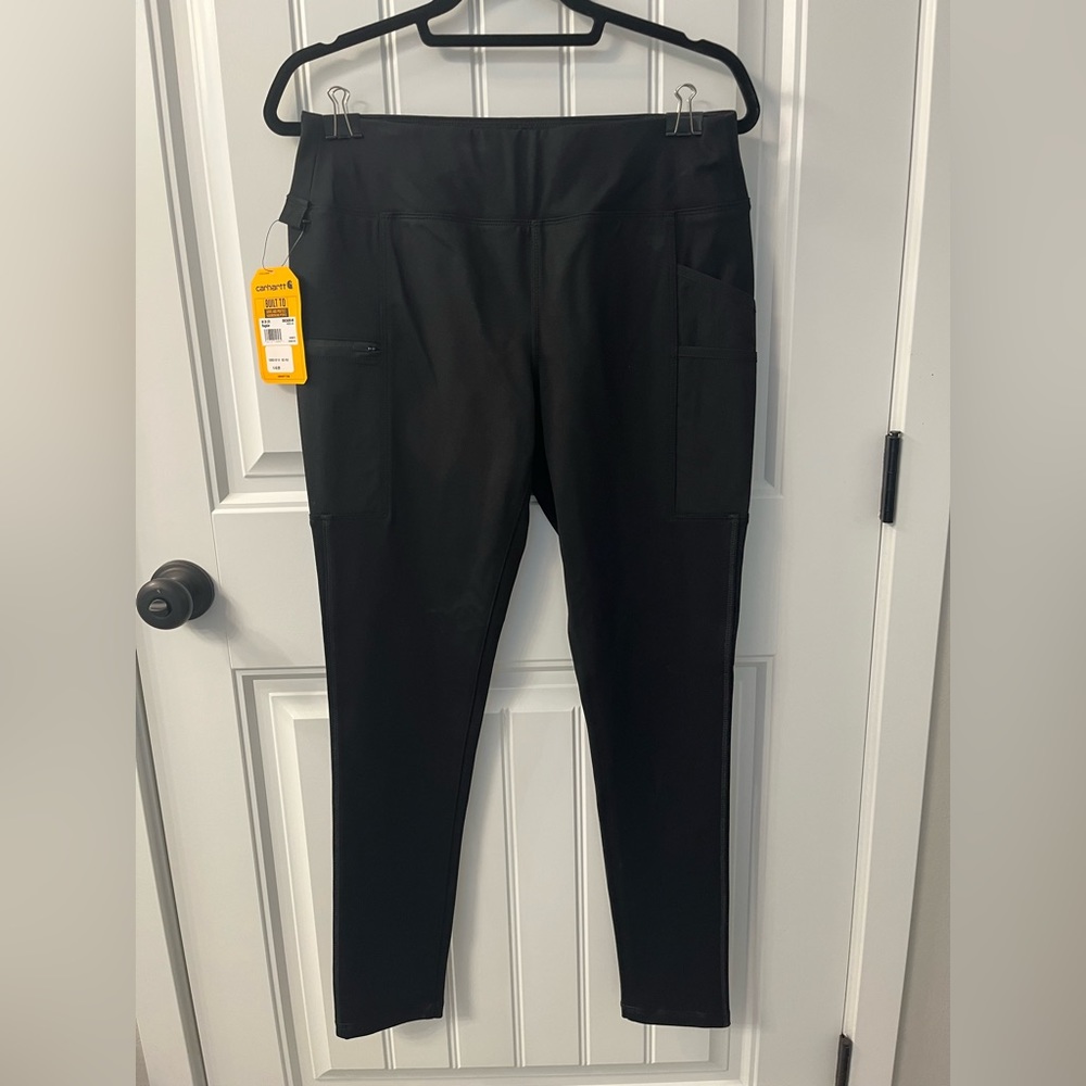 Women’s Carhartt fitted black pants.  Never worn, brand new.  Size medium.